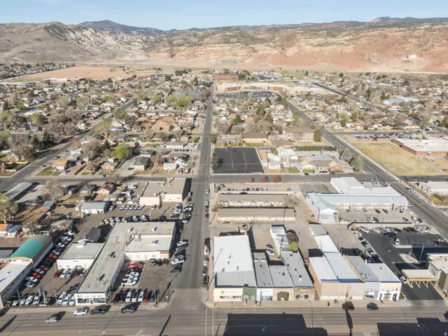 Aerial view of property's location with a mountainous background