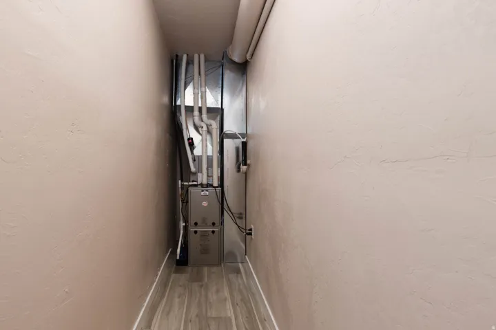 Utility room featuring heating unit