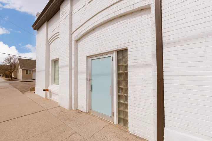 Entrance to property with brick siding
