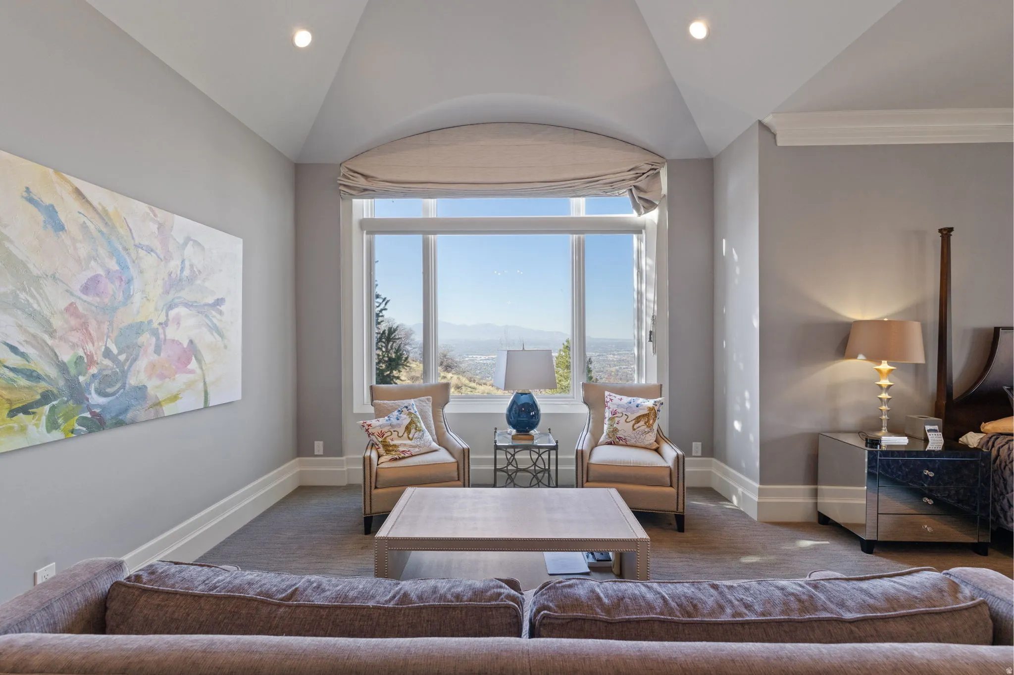 Living room featuring lofted ceiling and recessed lighting