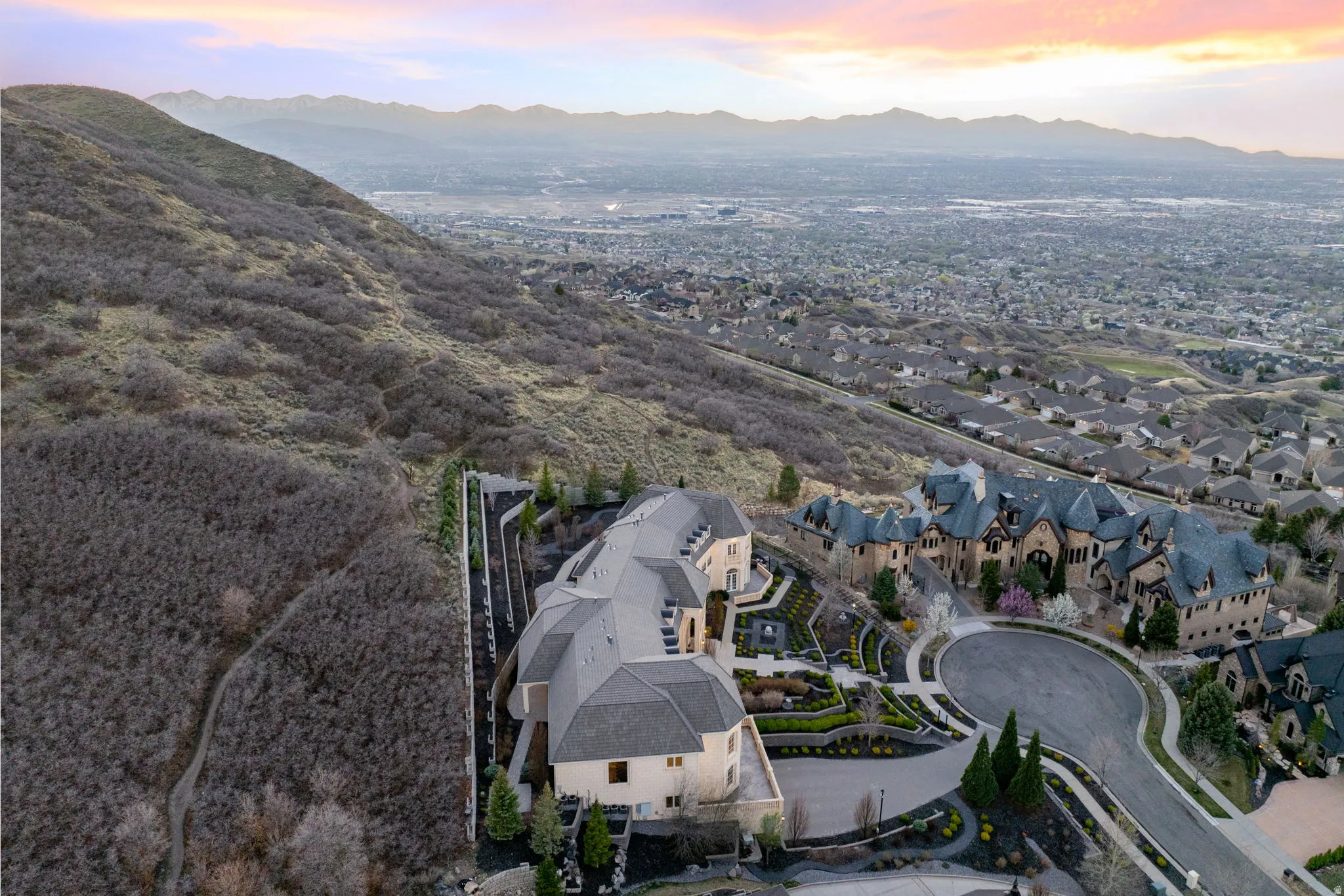 Aerial view at dusk of a residential view and a mountain view