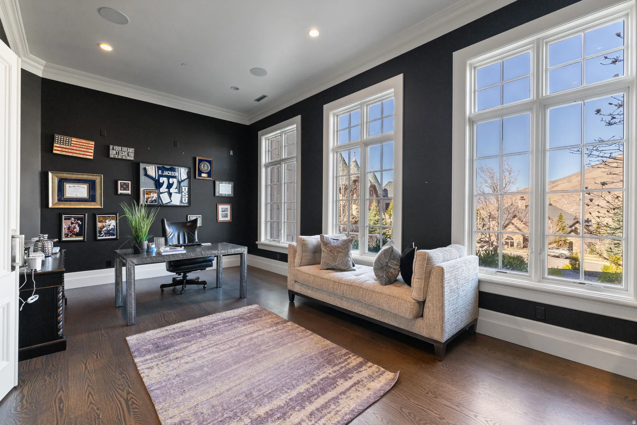 Home office featuring dark wood-style flooring, crown molding, and recessed lighting
