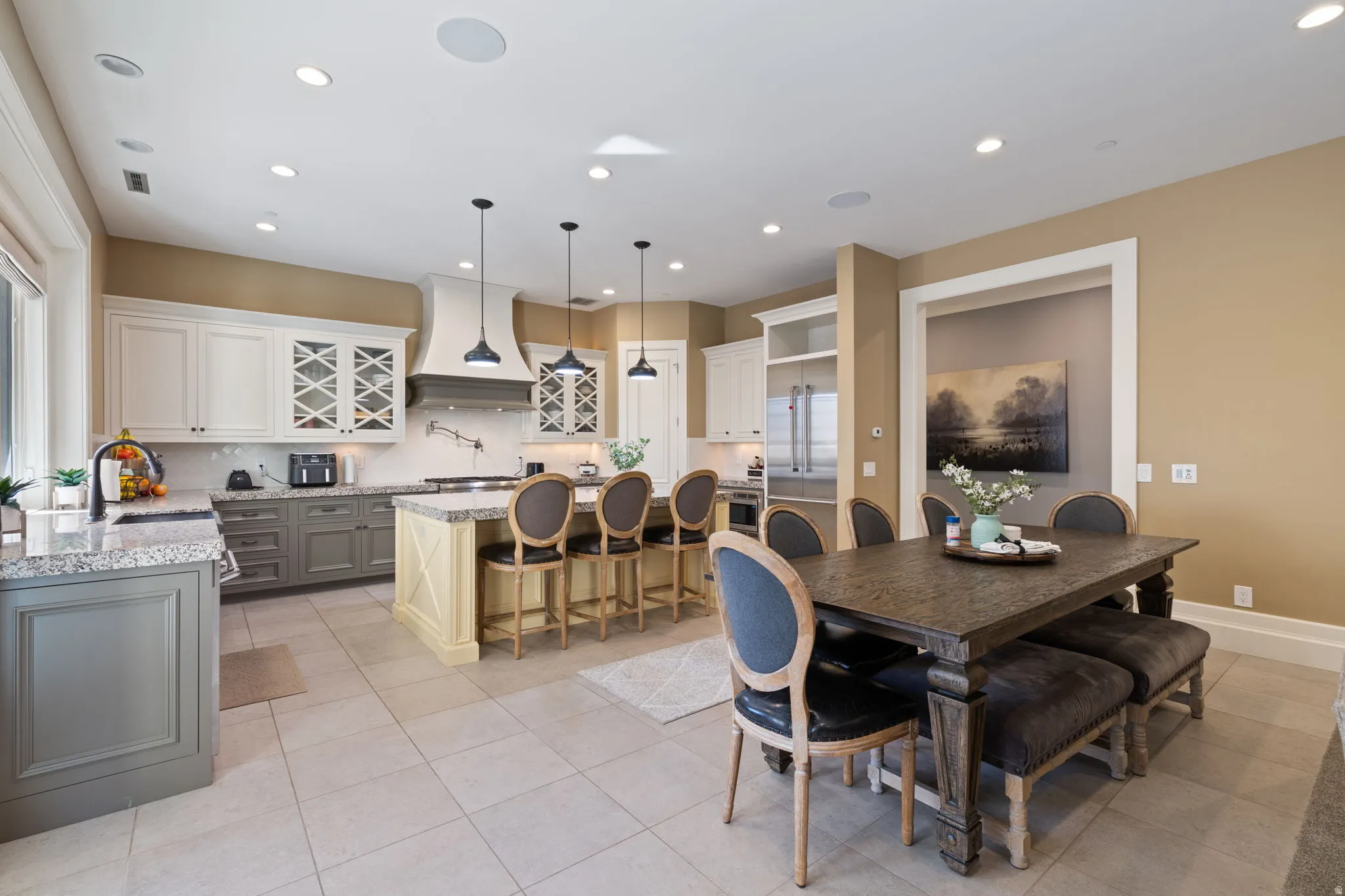 Dining room with recessed lighting and light tile patterned flooring