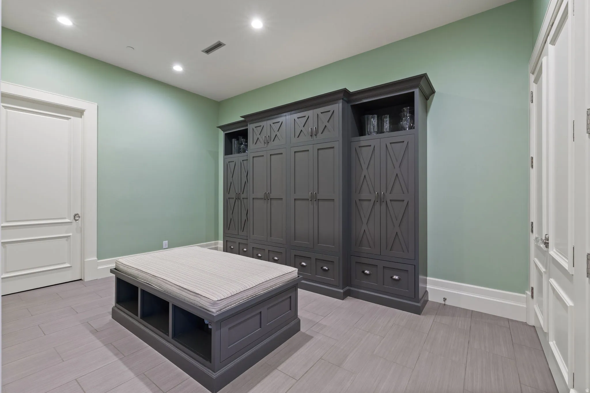 Mudroom with baseboards and recessed lighting