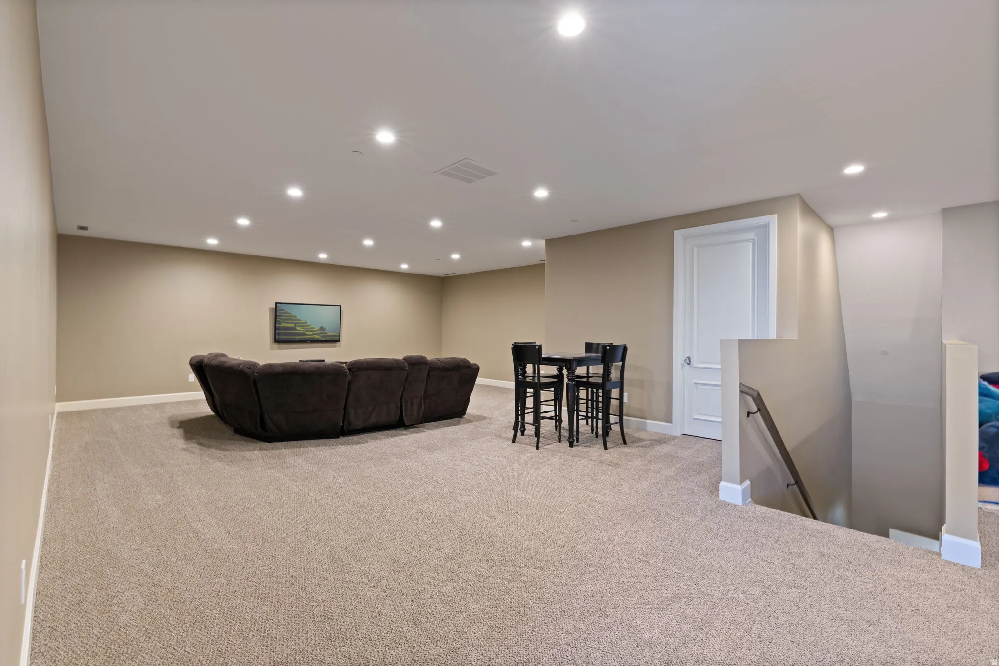 Living room featuring light carpet and recessed lighting