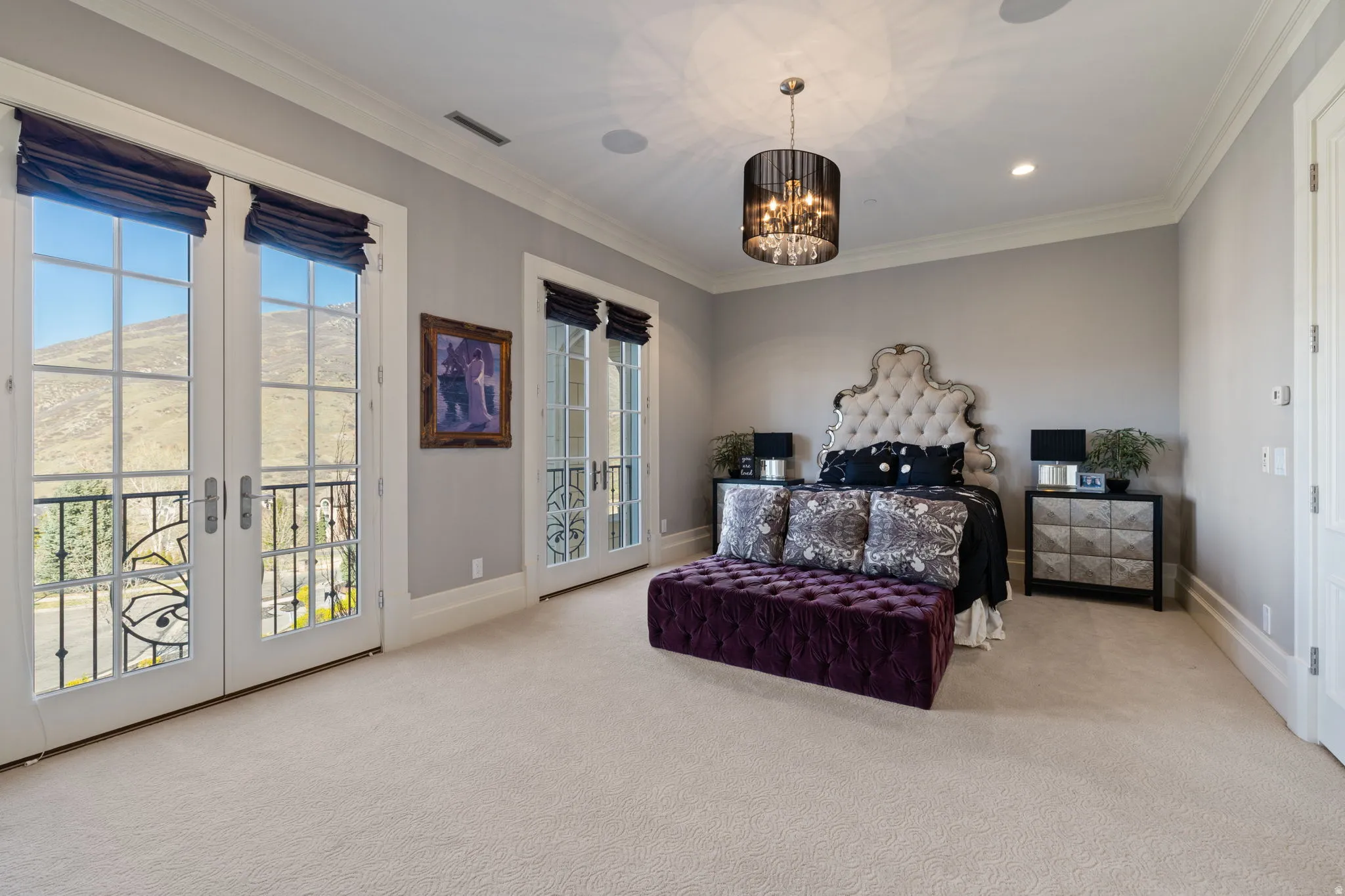 Bedroom featuring crown molding, light carpet, access to exterior, french doors, and suspended lighting