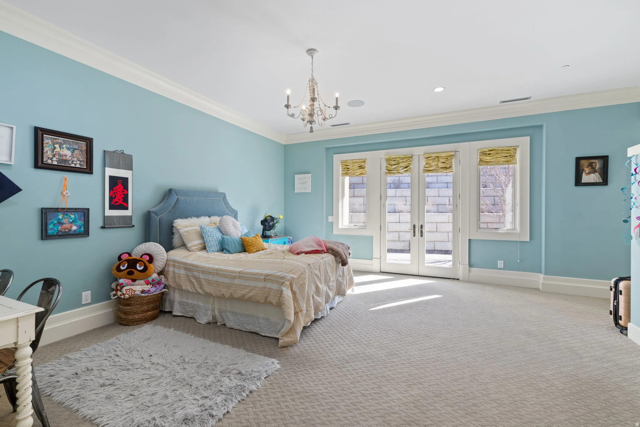 Bedroom with french doors, crown molding, carpet flooring, access to outside, and suspended lighting