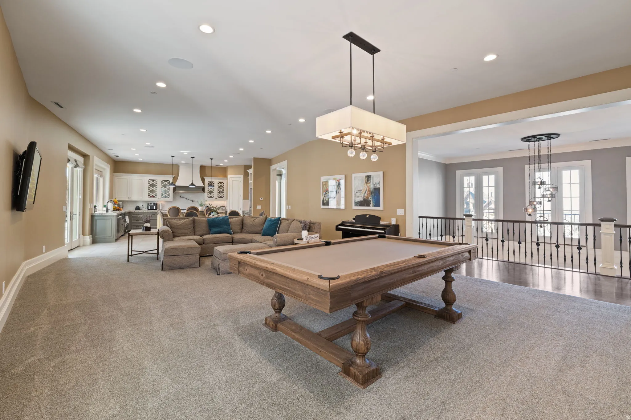 Playroom featuring pool table, suspended lighting, and carpet