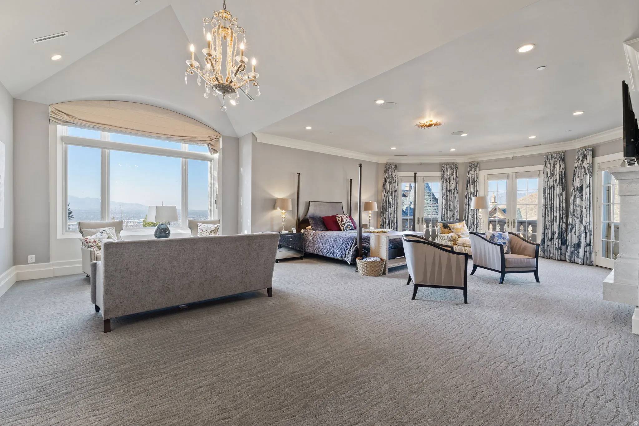 Carpeted bedroom featuring crown molding, access to outside, and hanging lights