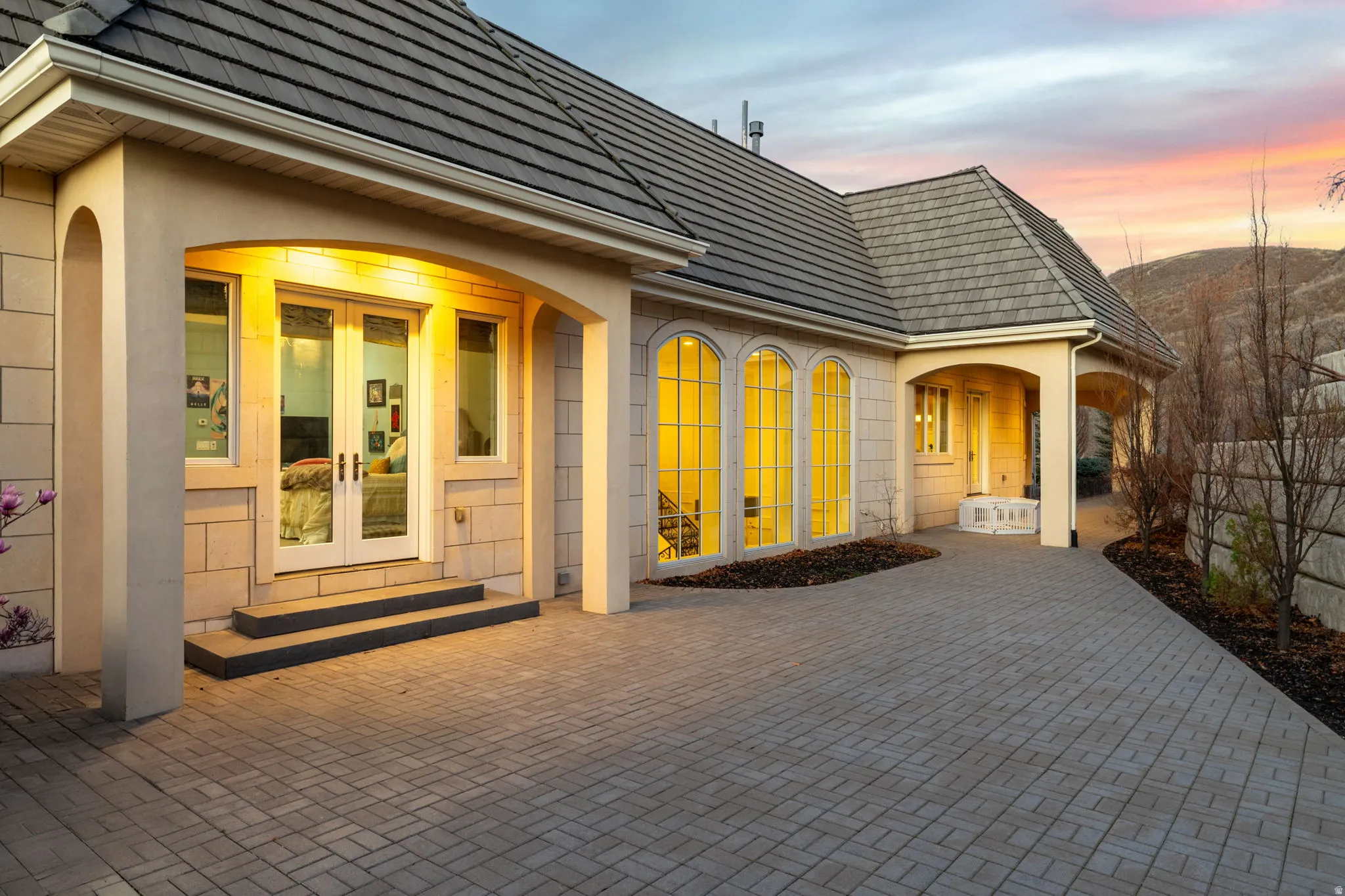 Doorway to property with french doors and stucco siding