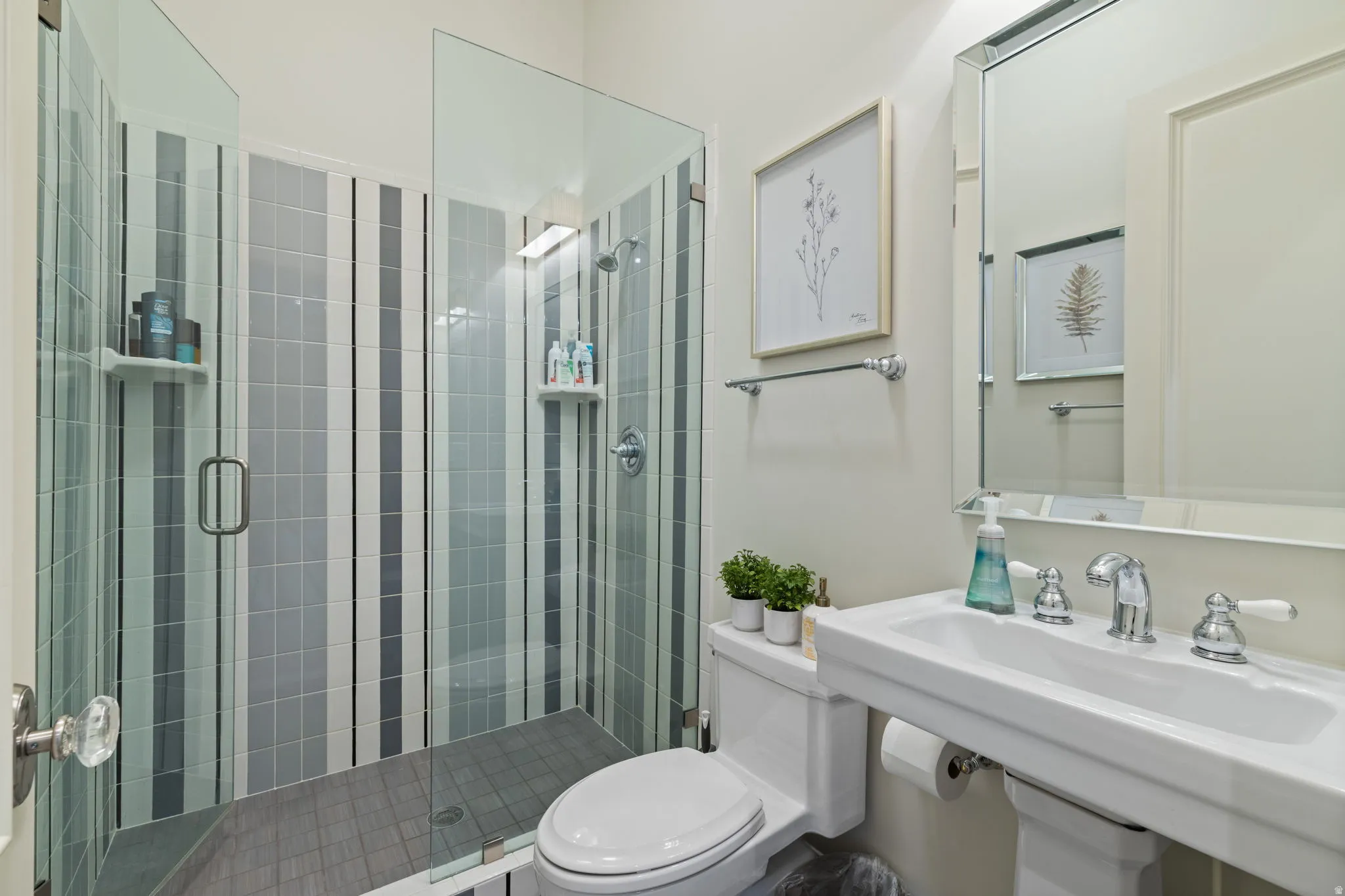 Full bathroom featuring toilet and a shower stall