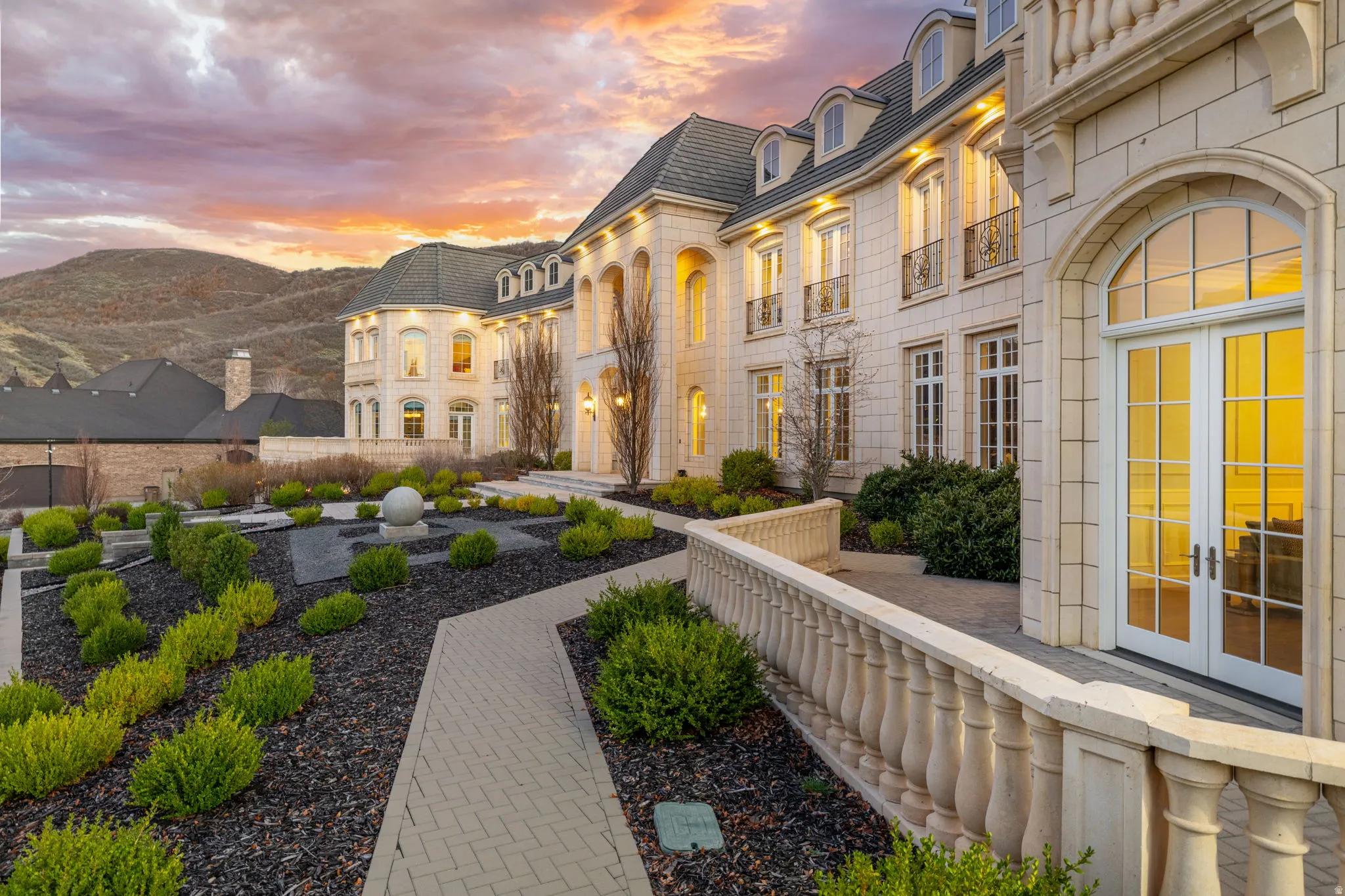 Yard at dusk featuring french doors