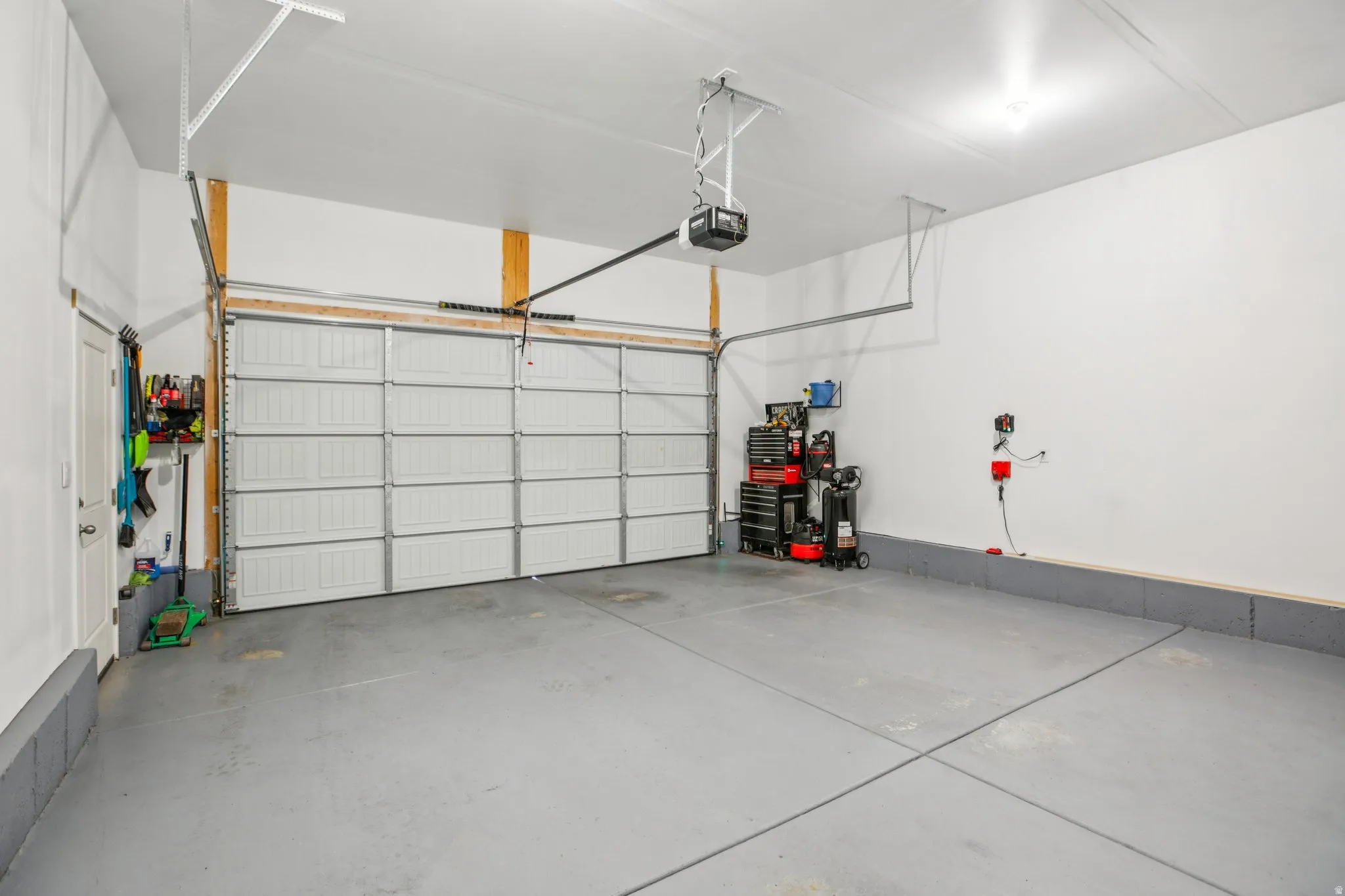 Garage featuring a garage door opener
