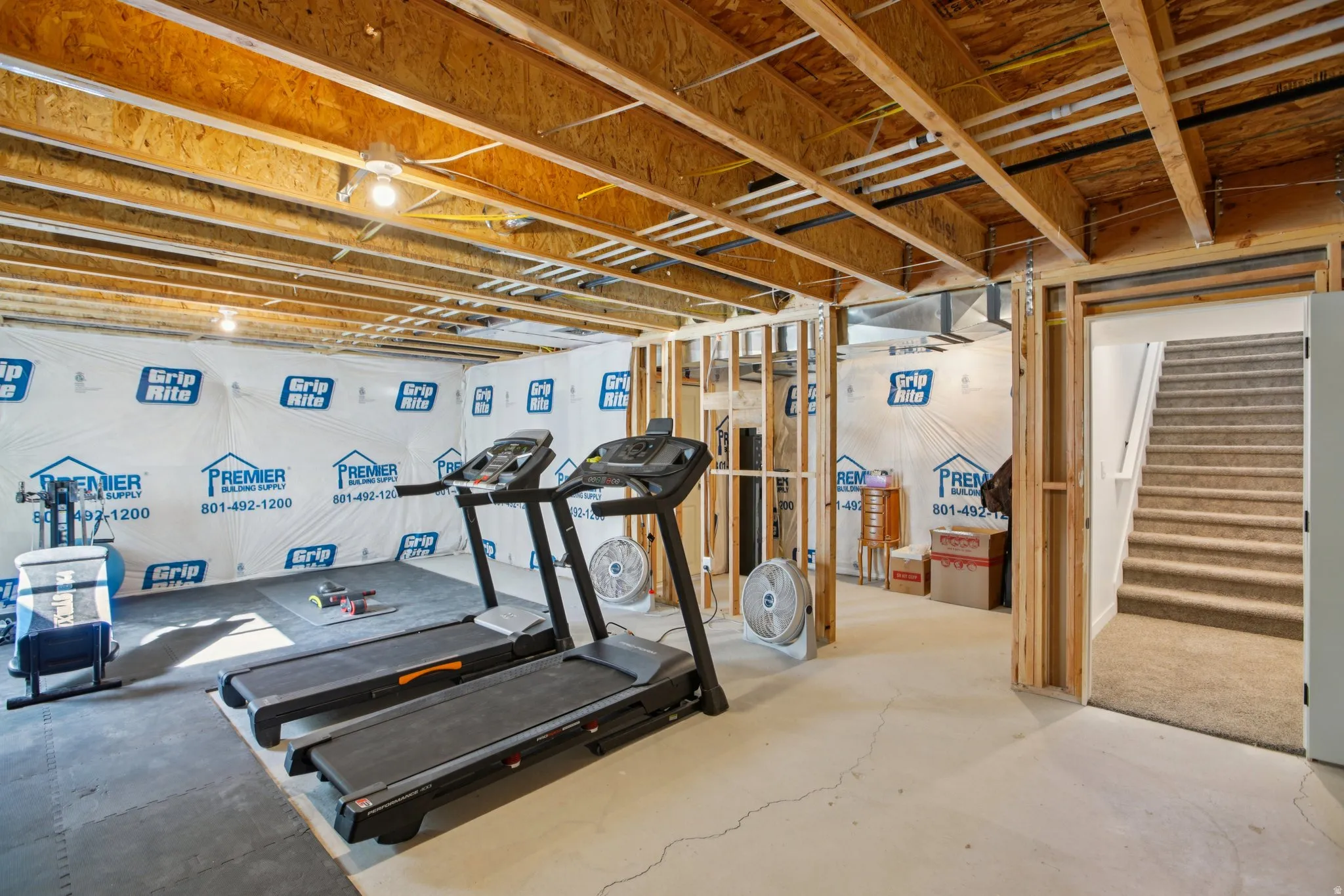 Exercise room featuring concrete flooring