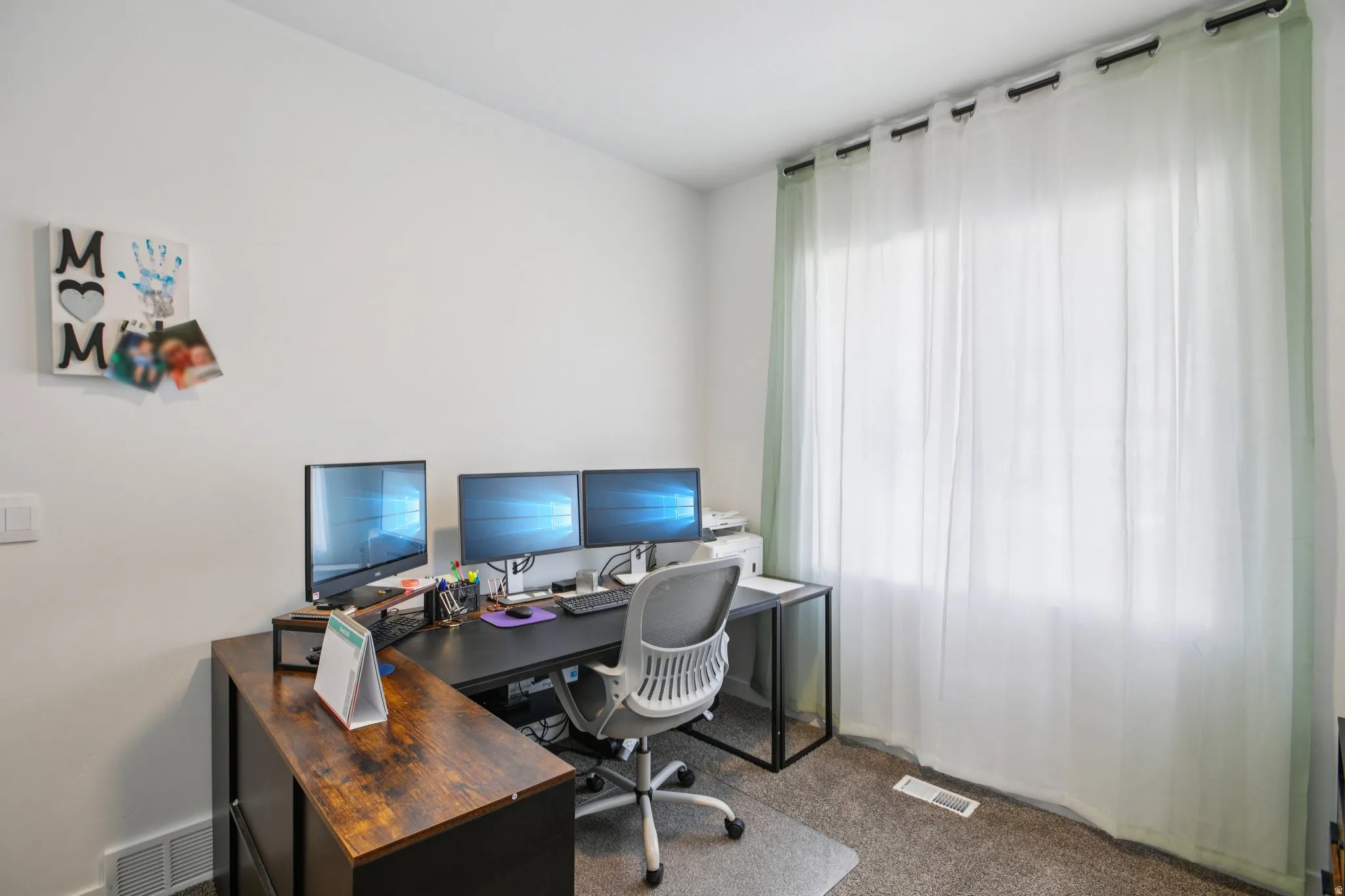 Office area with dark colored carpet