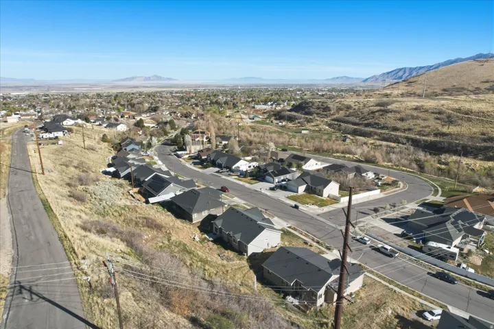 Aerial perspective of suburban area with a mountain backdrop