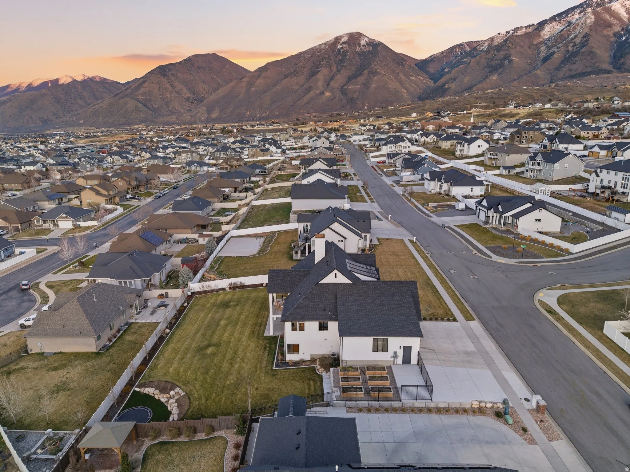 Aerial view at dusk of a mountain view and a residential view