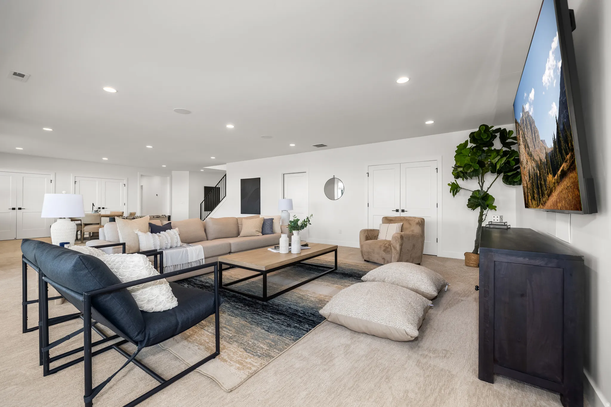 Living area with recessed lighting and baseboards