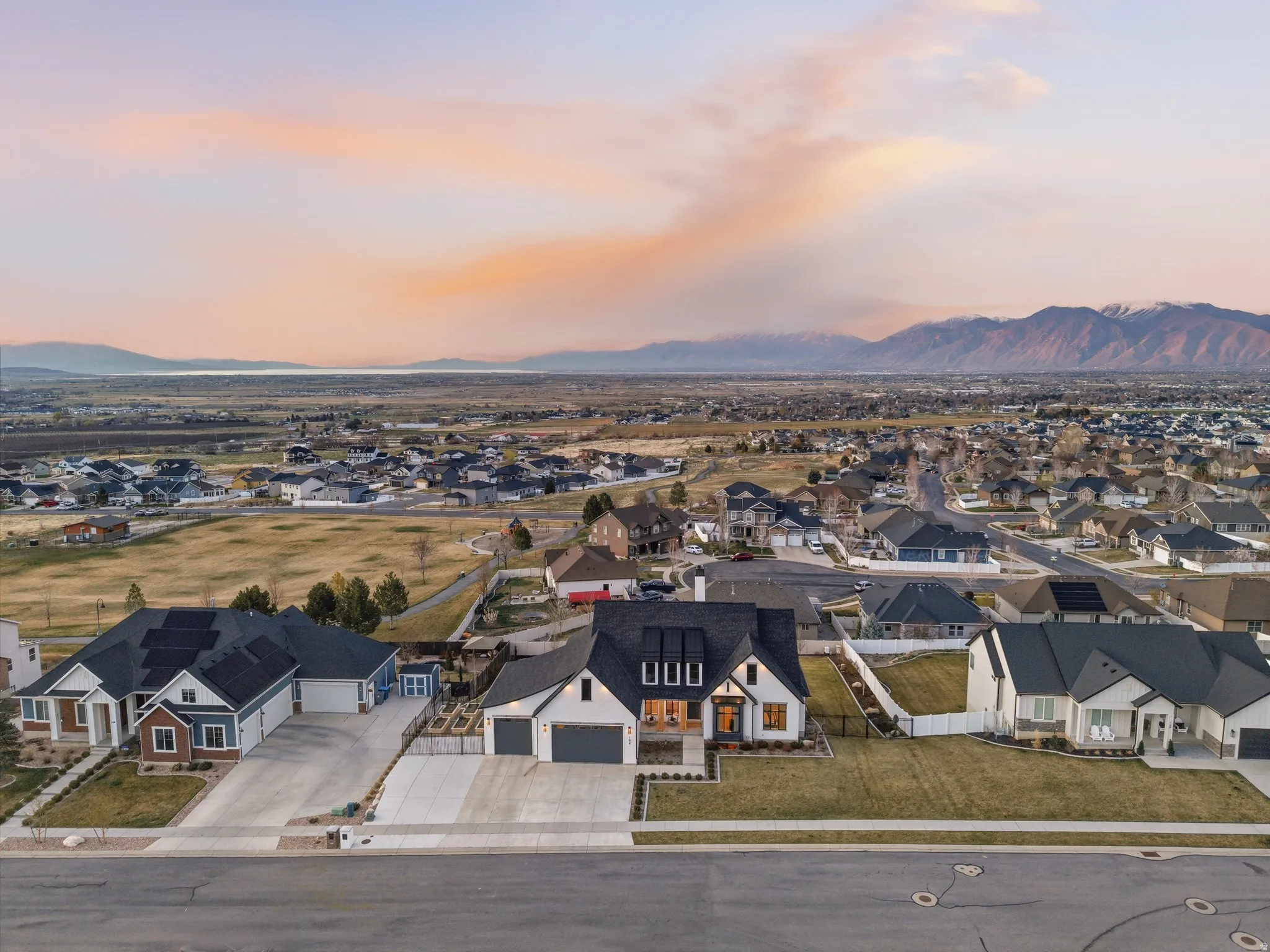 Aerial view at dusk of a residential view and a mountain view