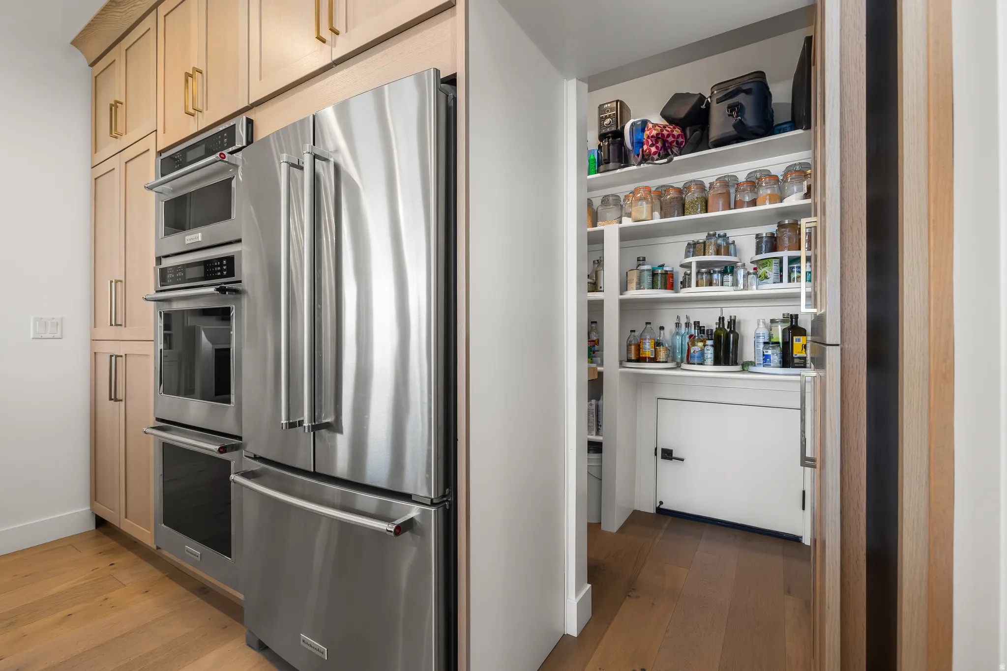 Kitchen with stainless steel appliances and light wood finished floors