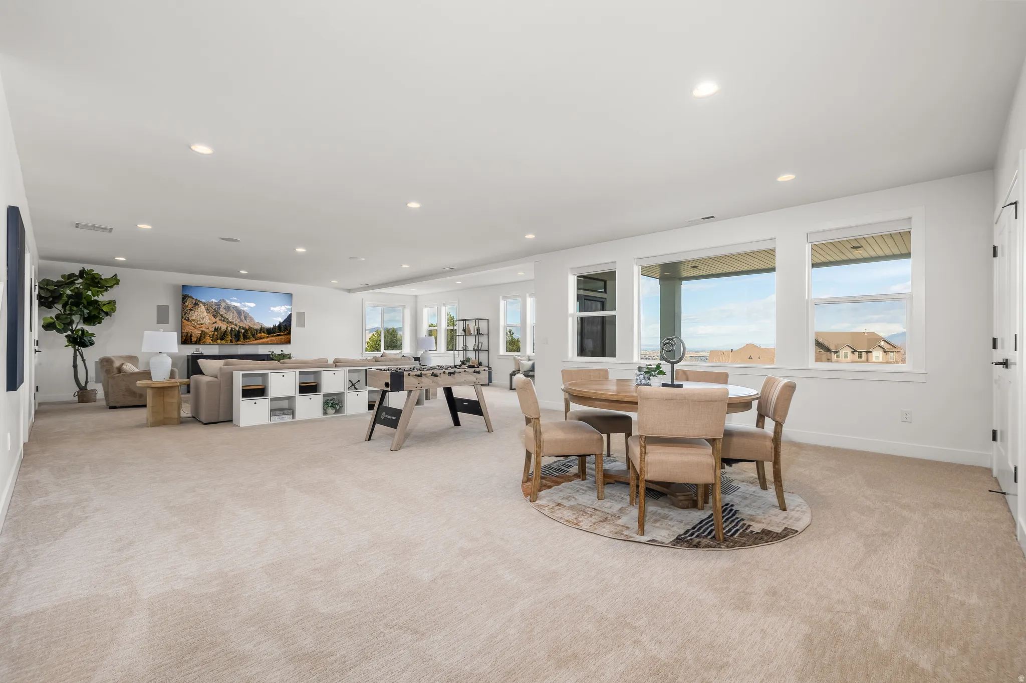 Dining area featuring recessed lighting, light carpet, and healthy amount of natural light