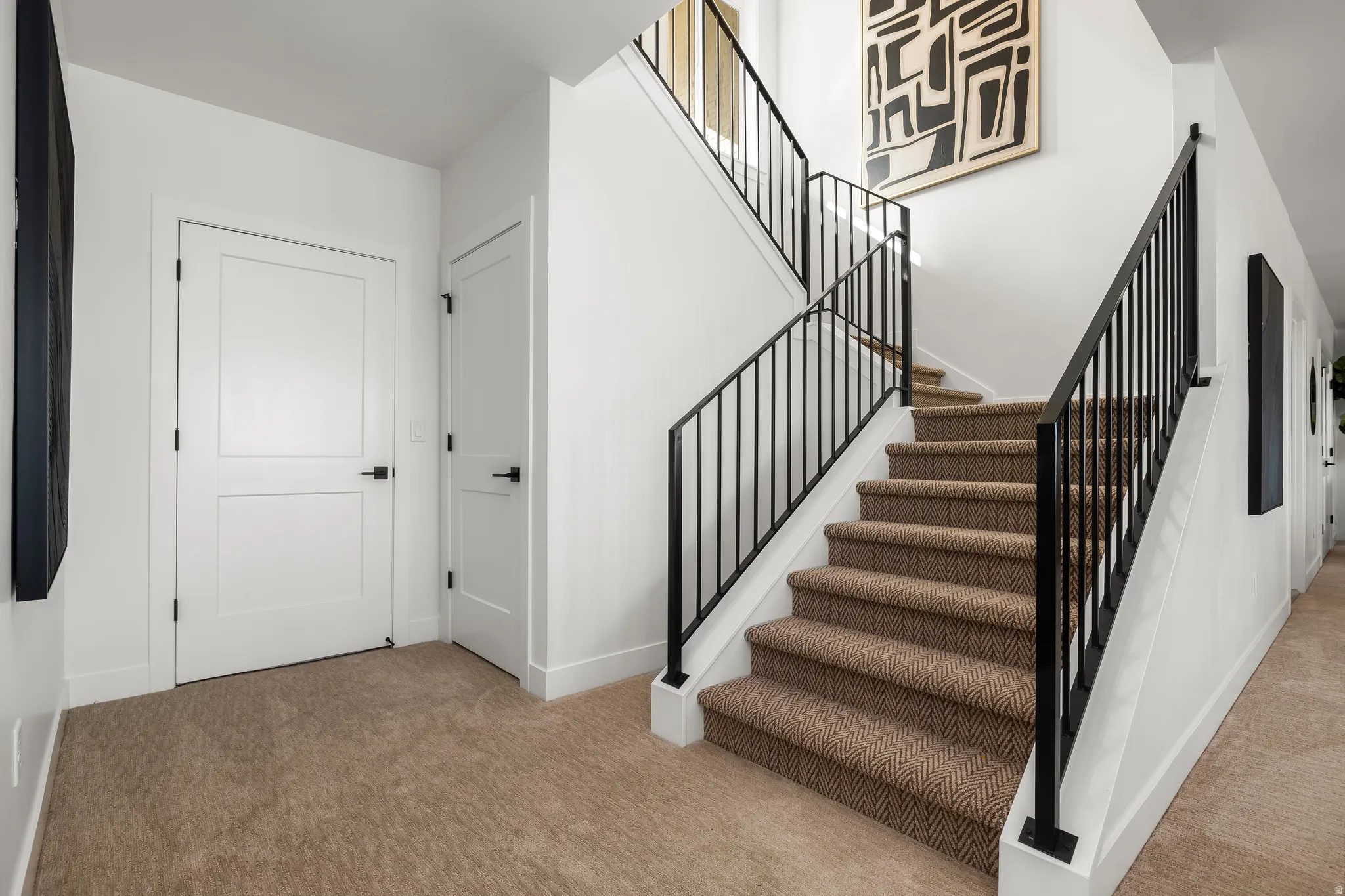 Staircase featuring carpet