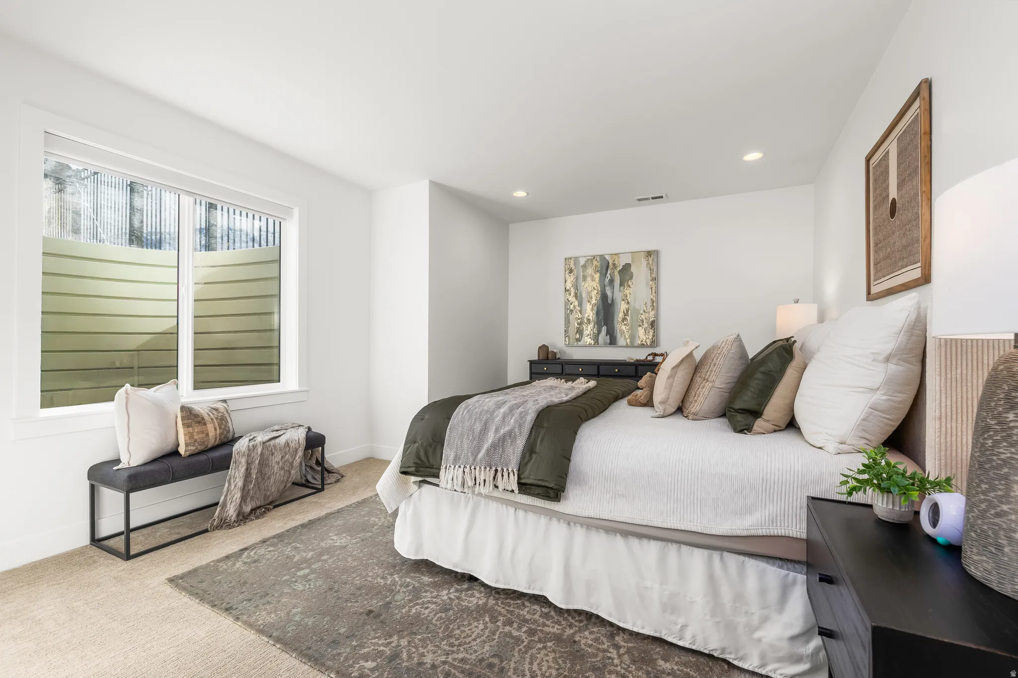 Carpeted bedroom featuring recessed lighting and baseboards
