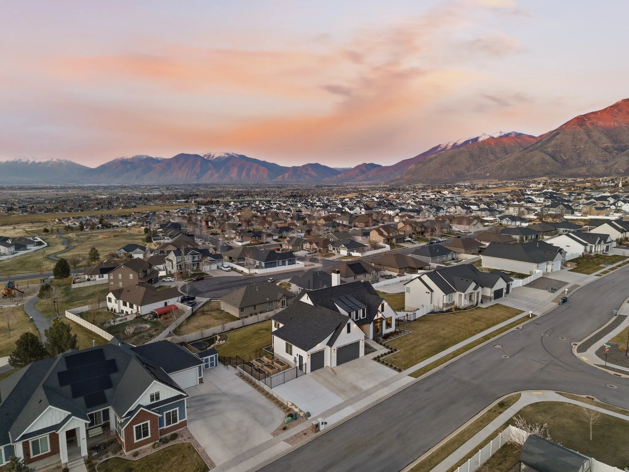 Aerial view of residential area featuring a mountain backdrop