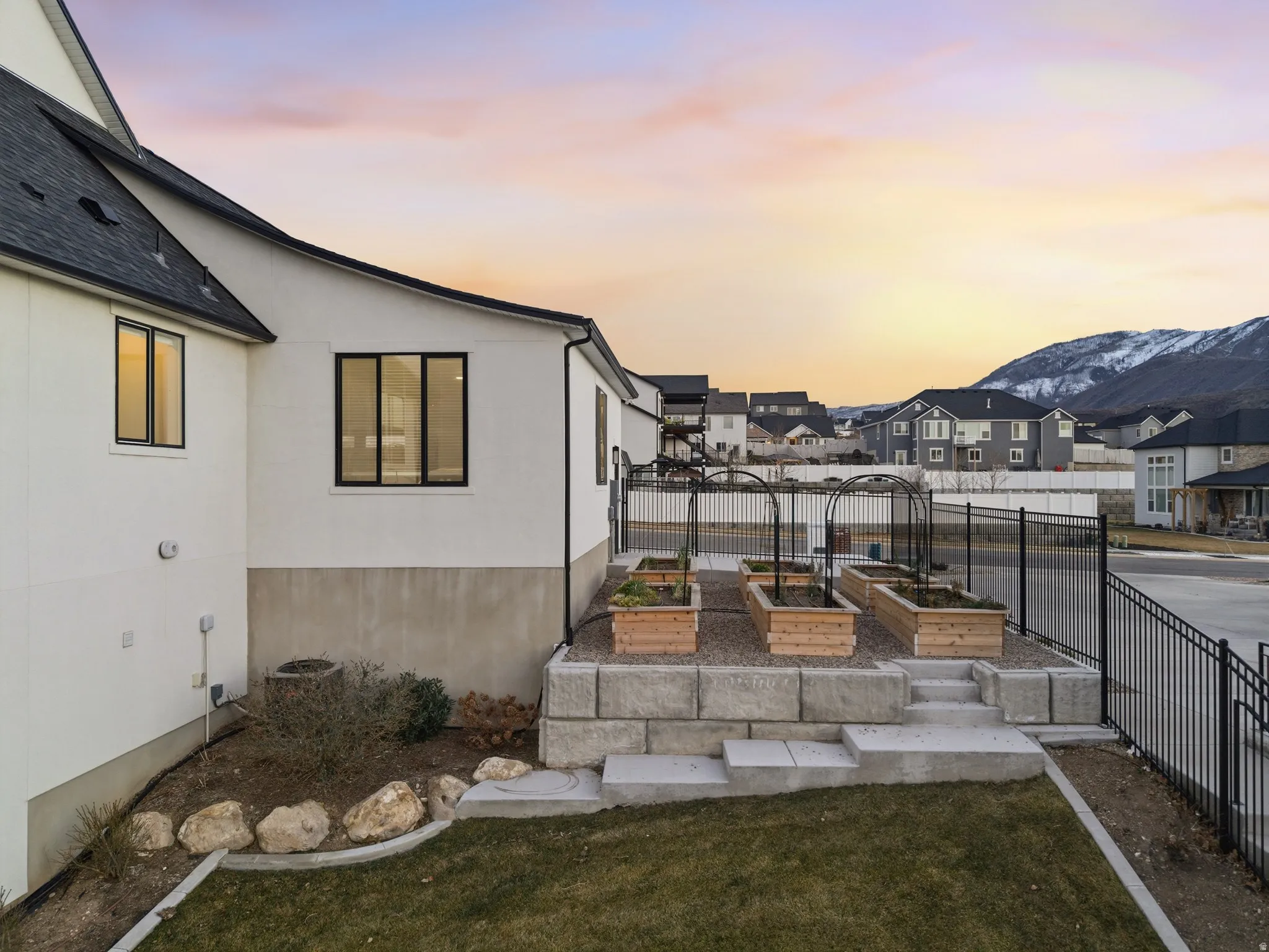 View of yard featuring a garden and a residential view