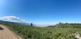 View of mountain backdrop with farmland and rural landscape