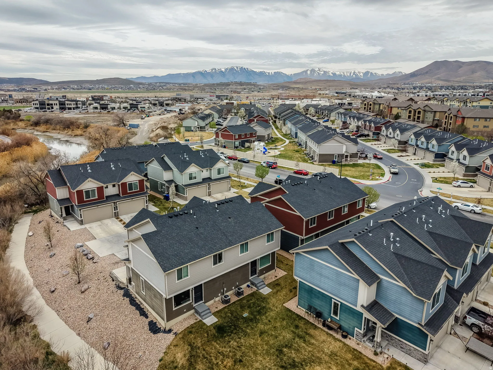 Aerial view of residential area featuring mountains