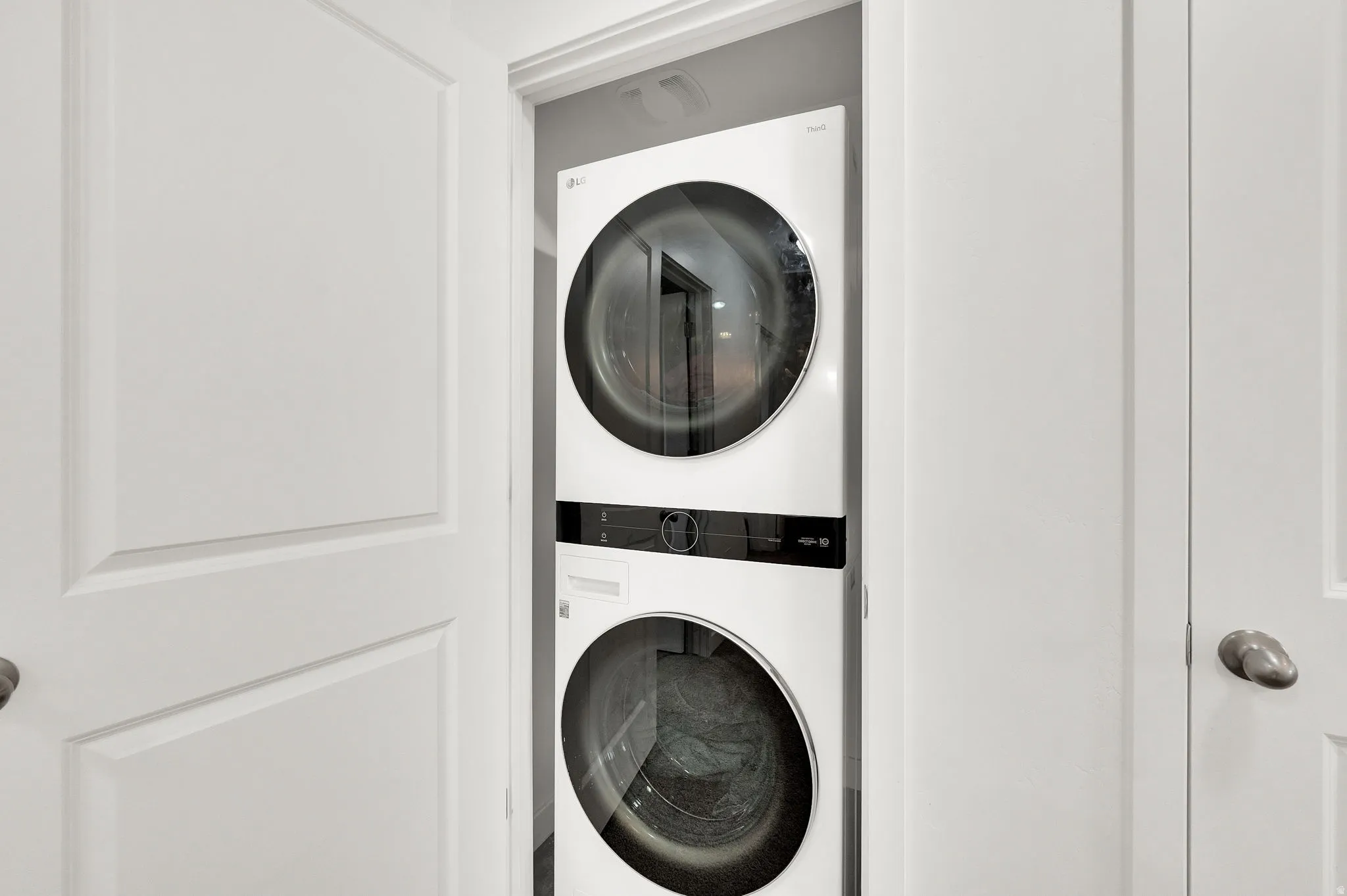 Laundry area with stacked washer / dryer