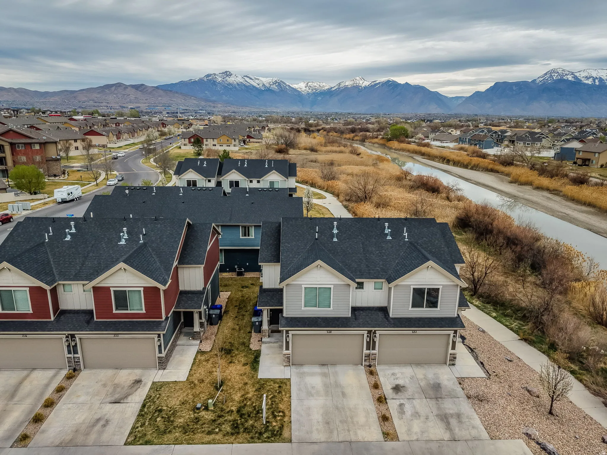 Aerial perspective of suburban area with a mountainous background