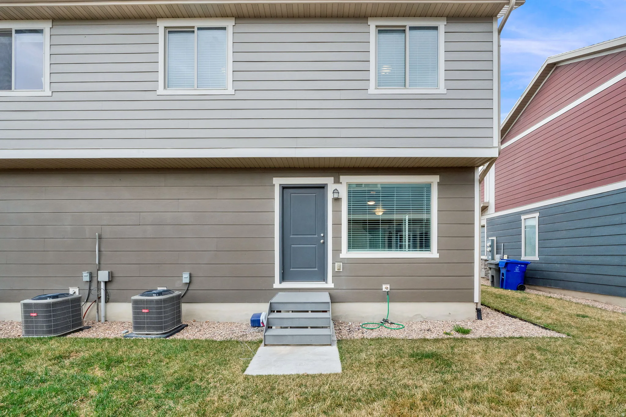 Back of house featuring a yard
