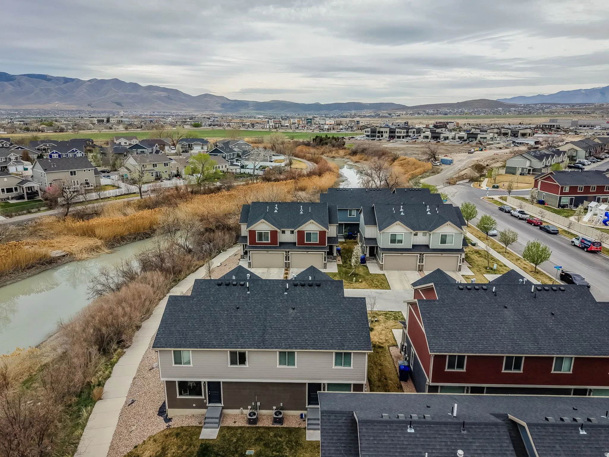 Aerial view of residential area featuring mountains