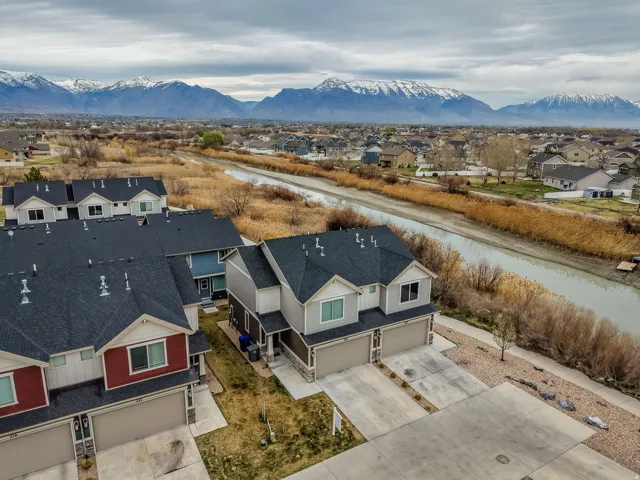 Aerial perspective of suburban area with a water and mountain view