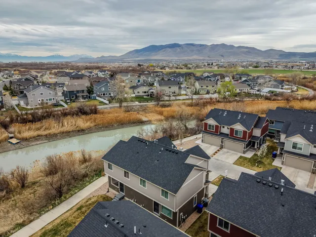Aerial perspective of suburban area with a mountain backdrop
