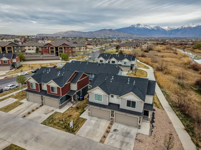 Aerial view of residential area featuring a mountain backdrop