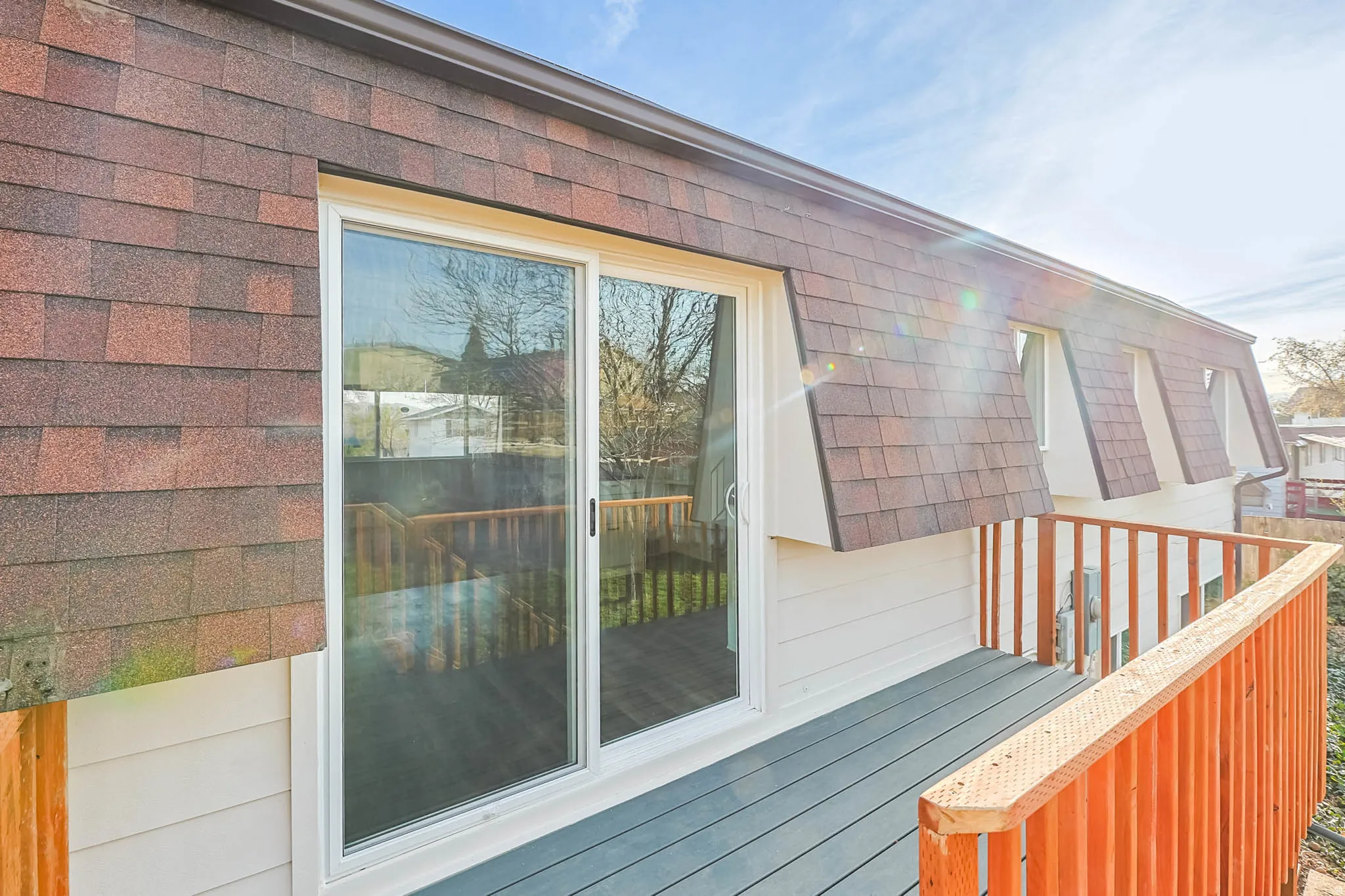 View of deck and sliding glass door to dining area.