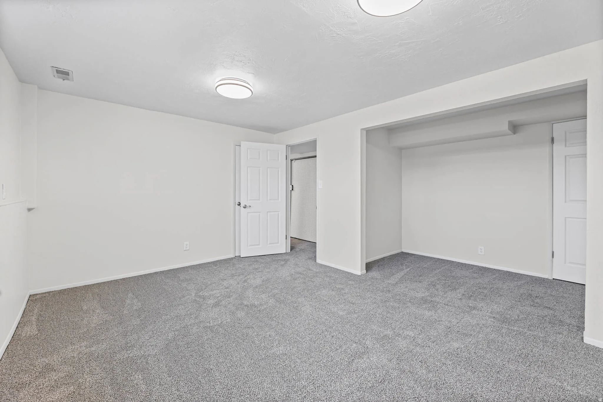 Family room off garage entry and storage room.