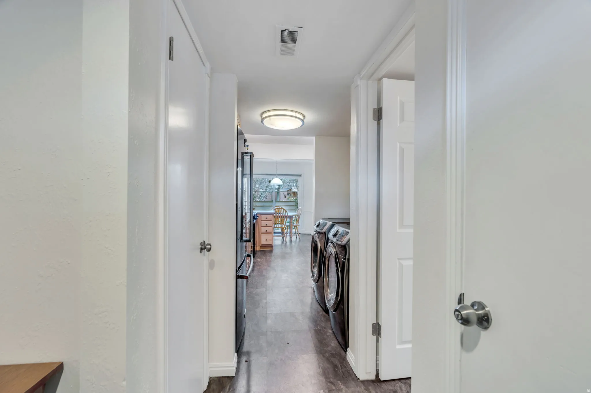 Laundry area featuring baseboards and washer and dryer