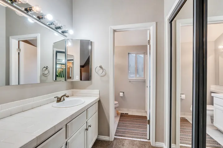 Full bathroom with toilet and vanity