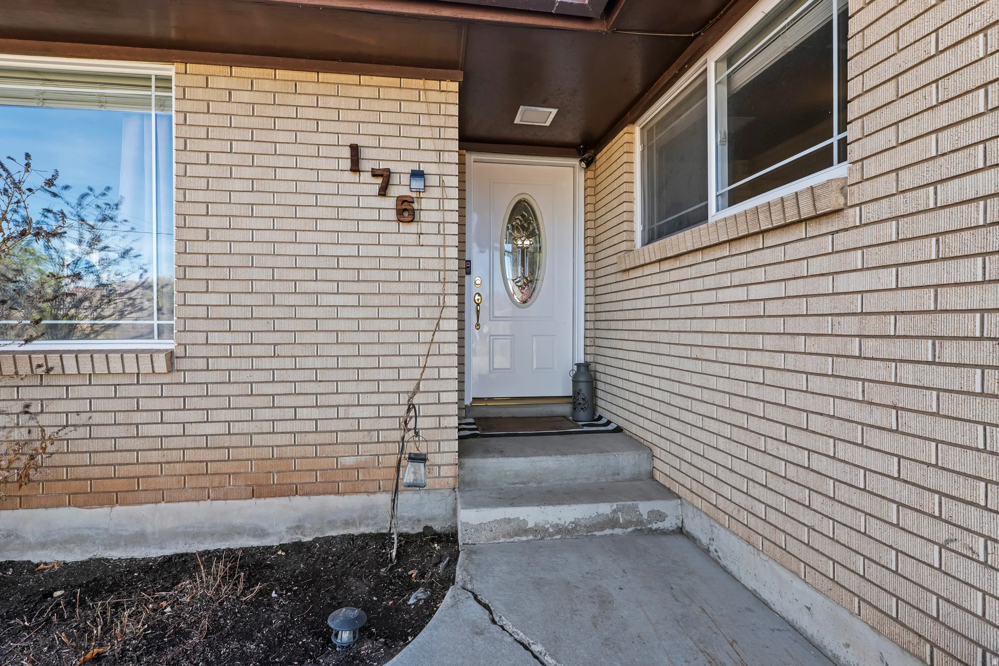 Property entrance with brick siding