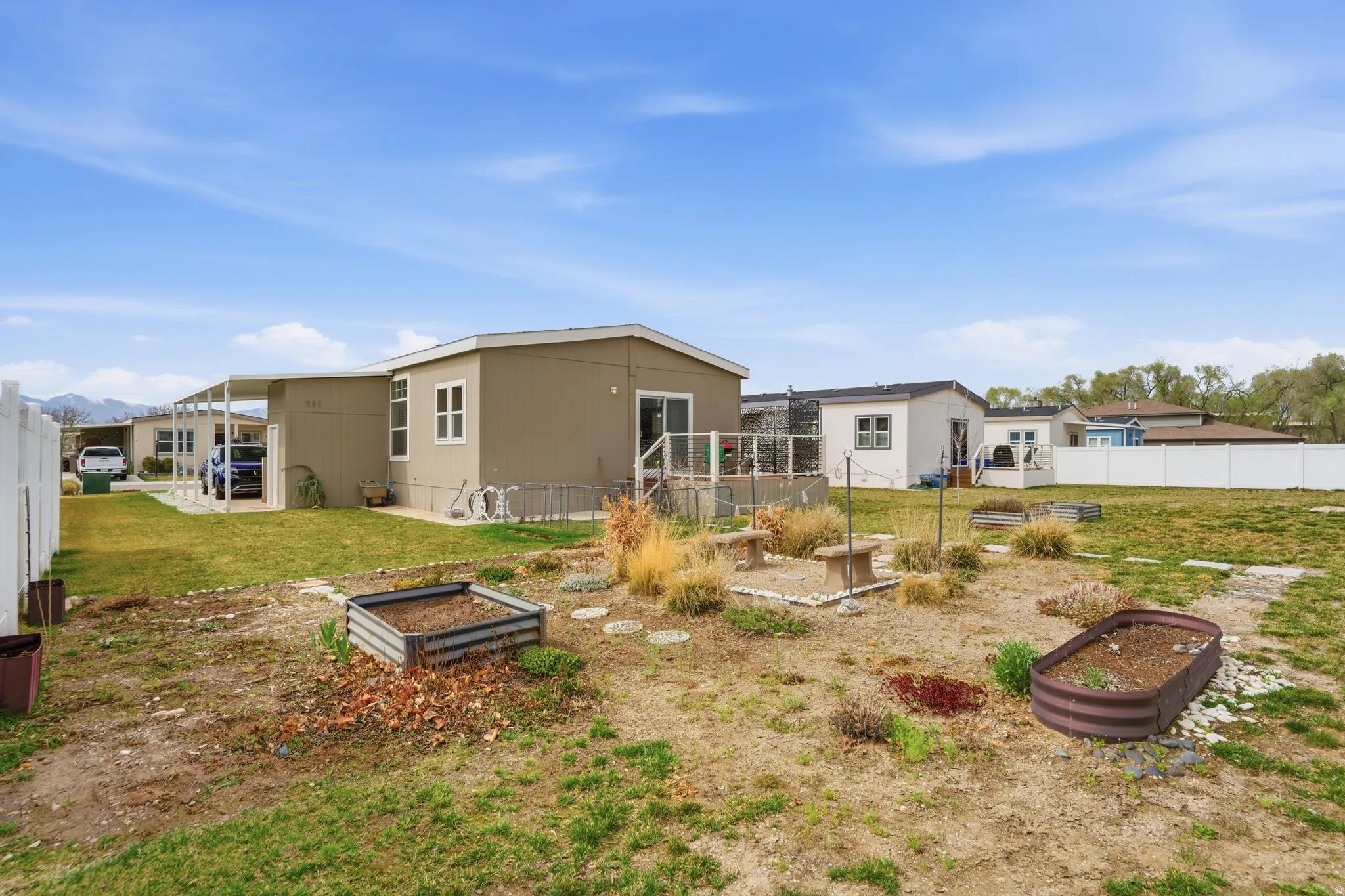Rear view of house with a garden and a patio