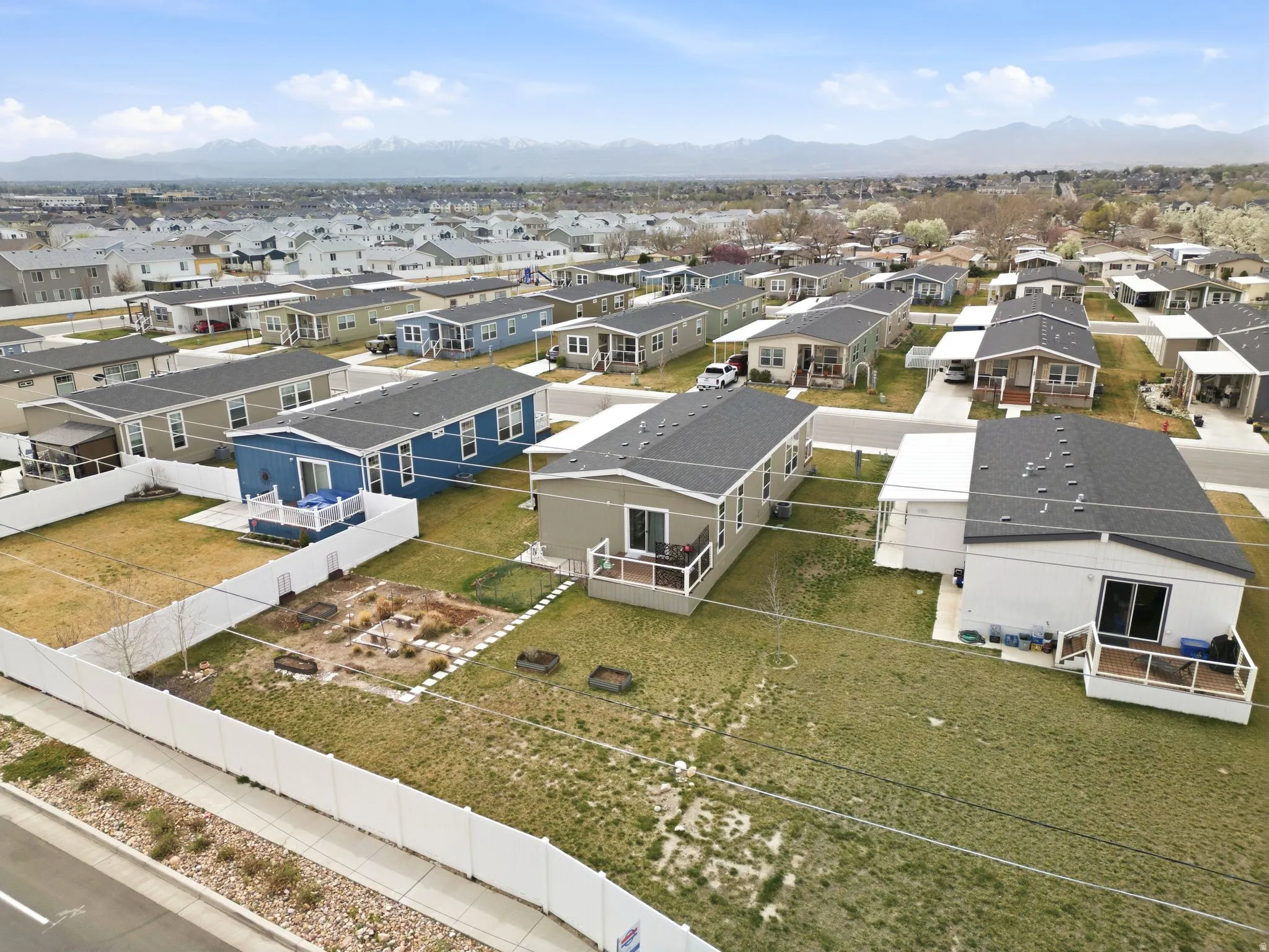 Aerial perspective of suburban area featuring a mountainous background