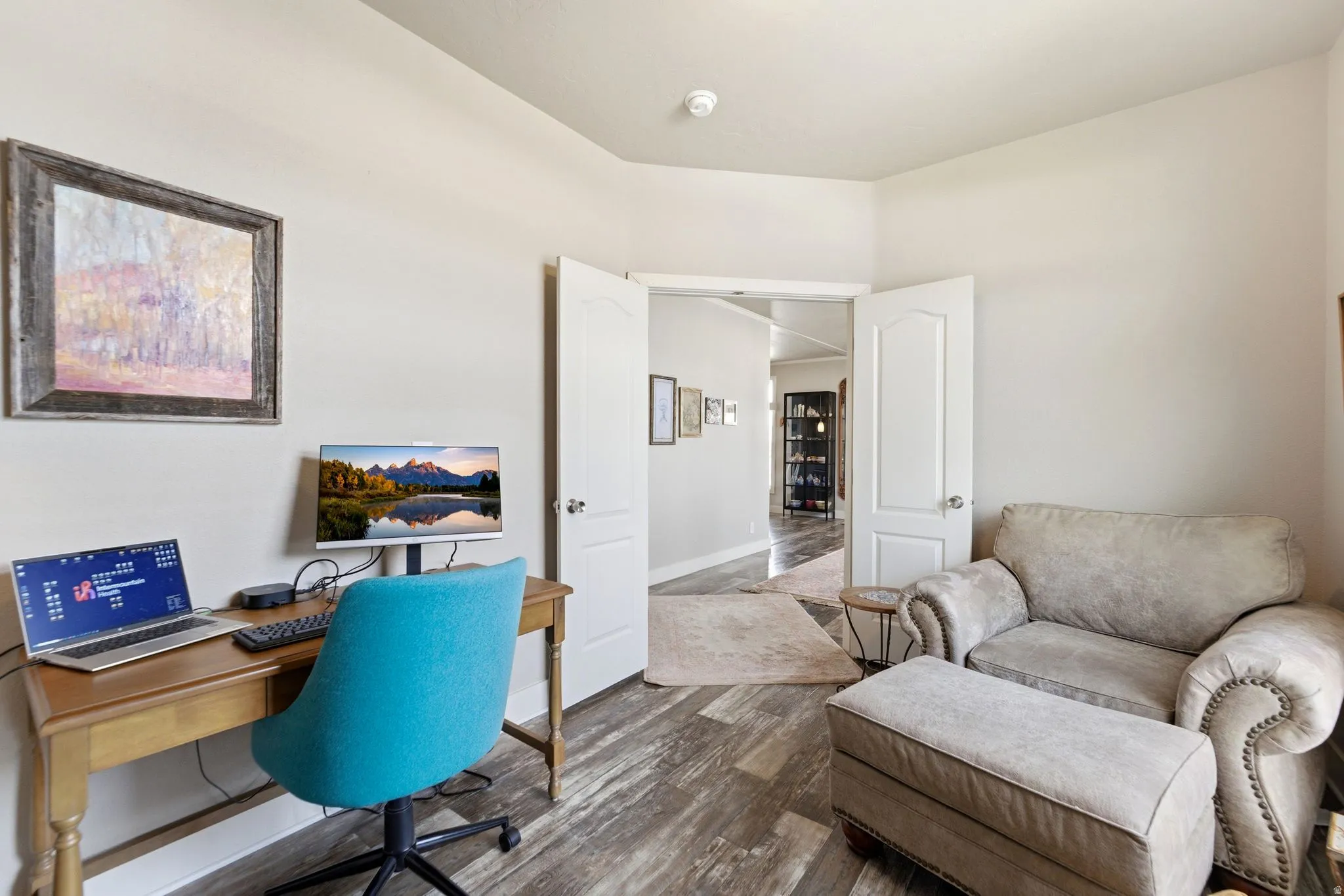 Office area with wood finished floors and baseboards