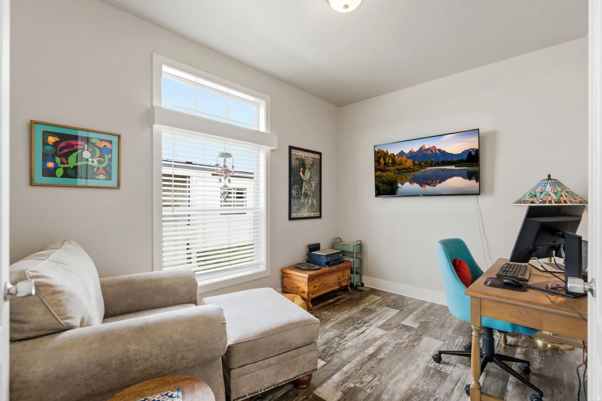 Office with wood finished floors and baseboards