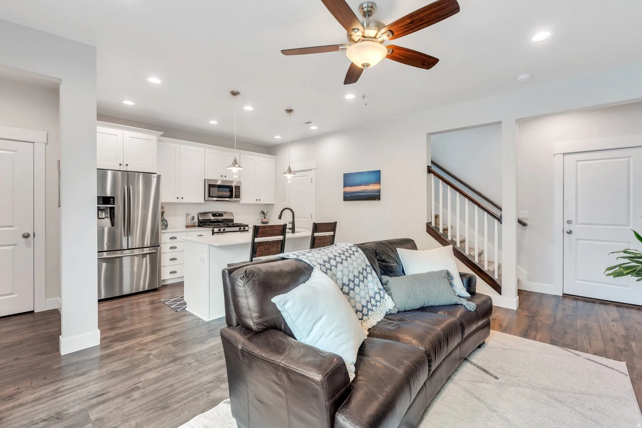 Living room with dark wood-style flooring