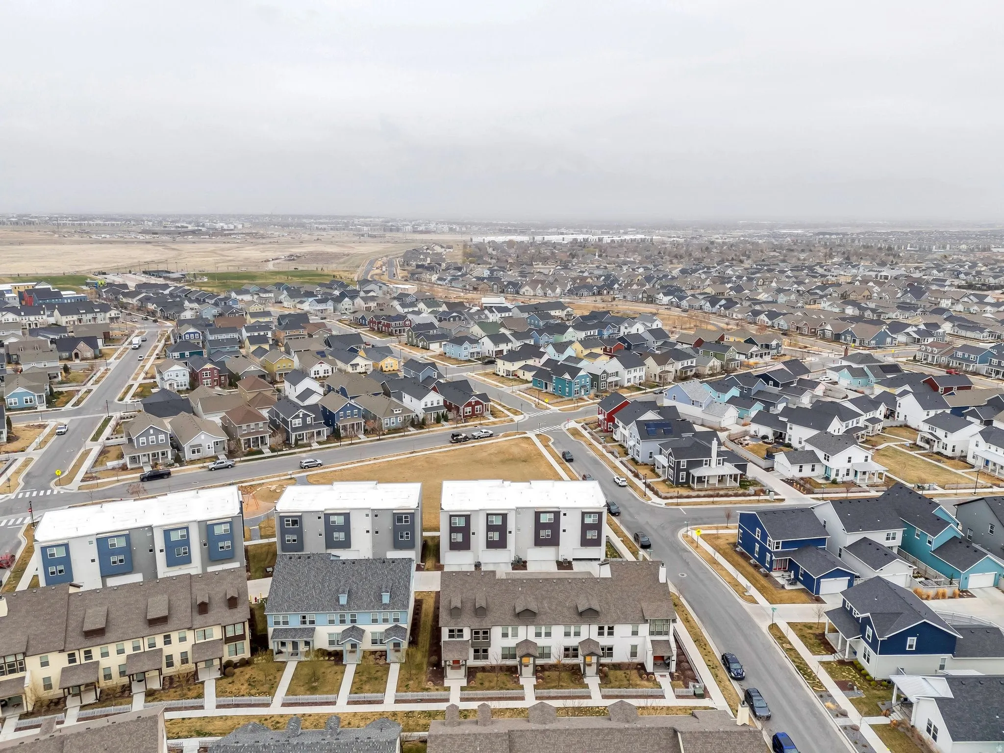 Aerial overview of property's location featuring nearby suburban area