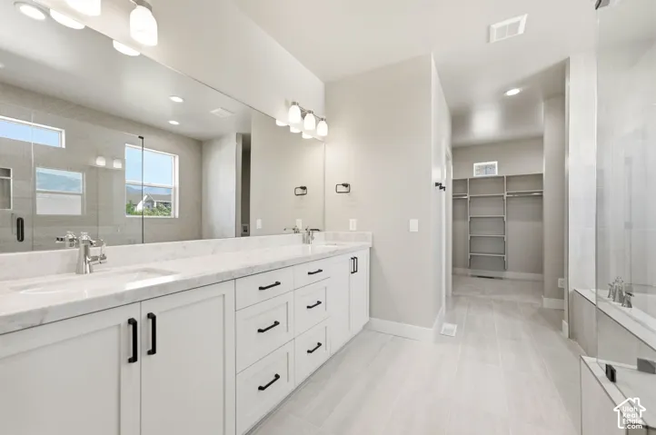 Dual sink vanity, large soaking tub, beautiful glass enclosed shower, washer/dryer hook-ups and nice size closet in primary bath.